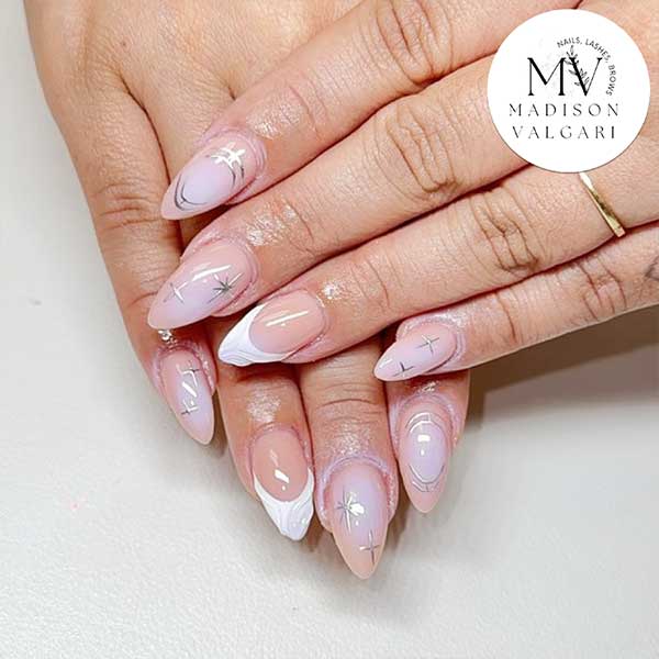 Milky blush almond nails with delicate silver star and chrome detailing